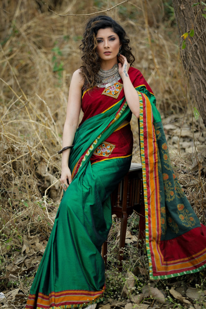 Exclusive green khun saree with block printed Ajrakh pallu and kutchi mirror work patches