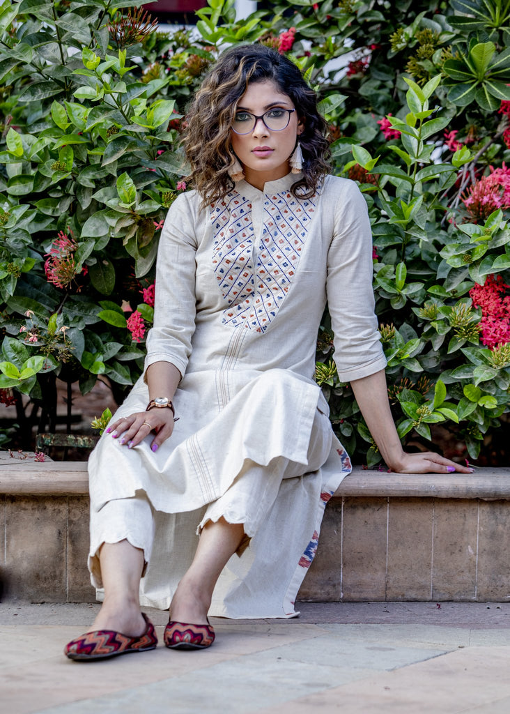 Off-white hand embroidered straight cut handloom cotton kurta with sequence work