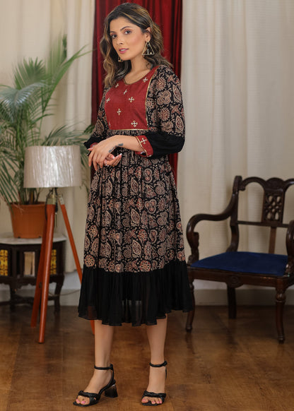 Black ajrakh flared dress with zari work and georgette hemline