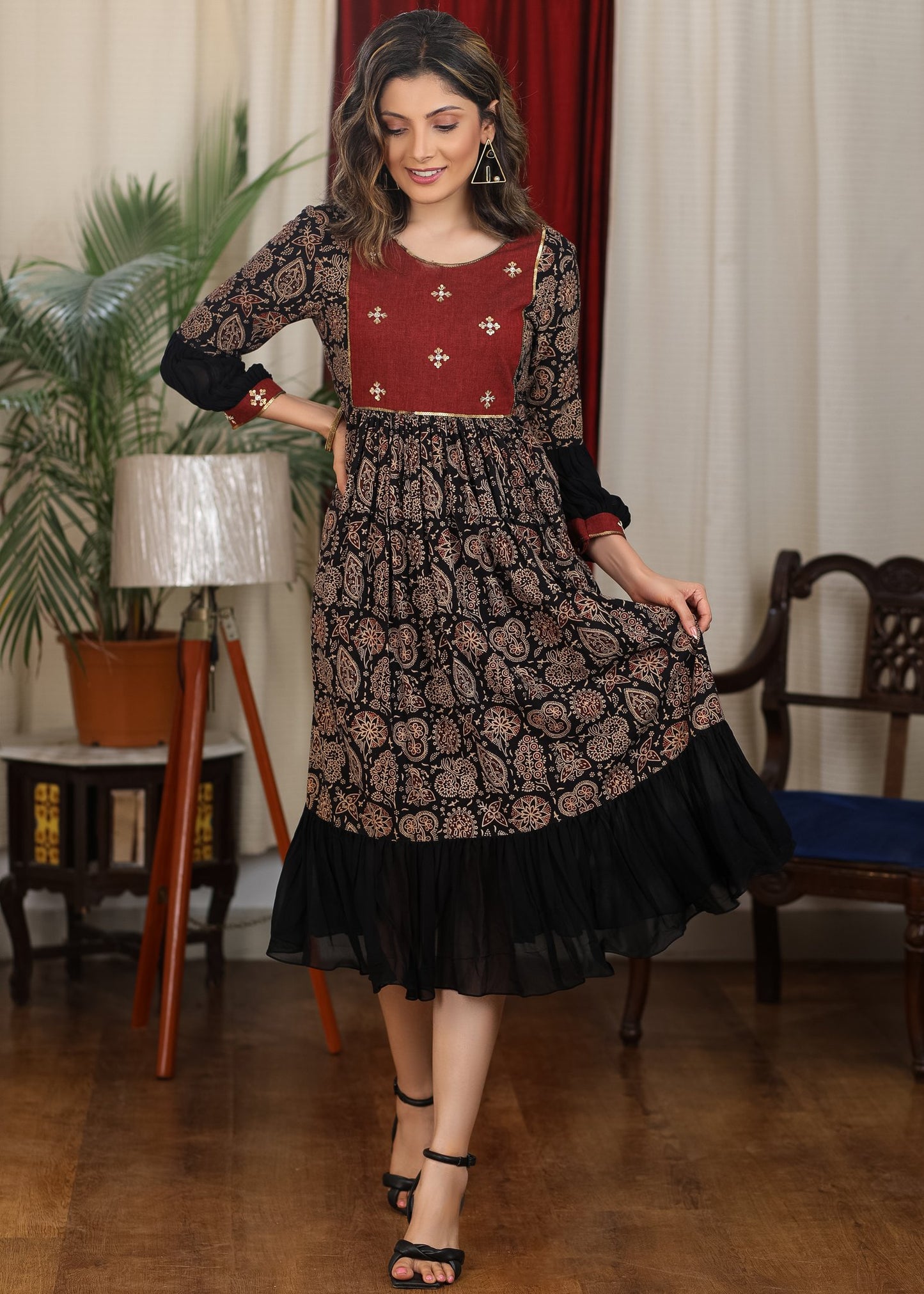 Black ajrakh flared dress with zari work and georgette hemline