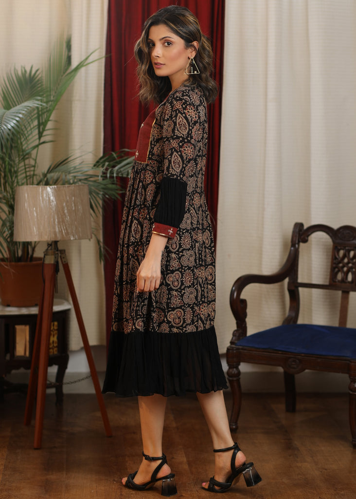 Black ajrakh flared dress with zari work and georgette hemline