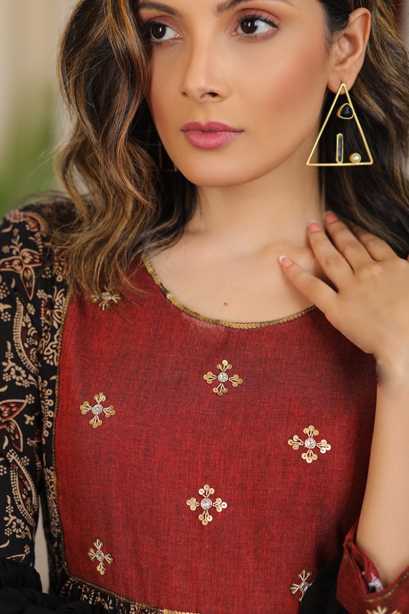 Black ajrakh flared dress with zari work and georgette hemline