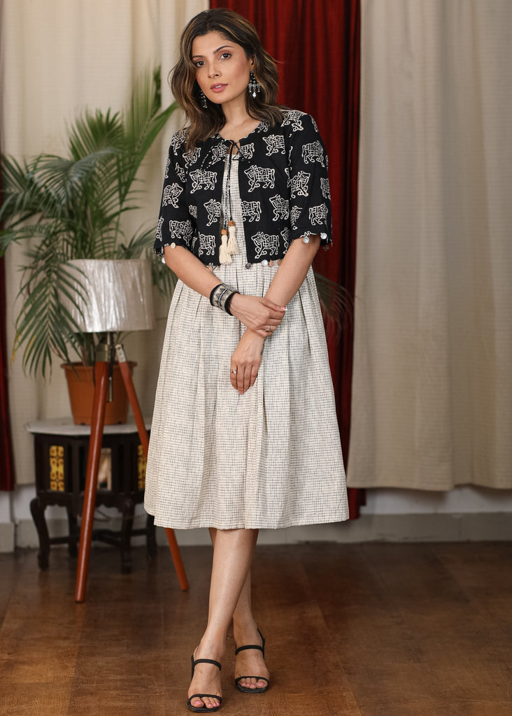 Ivory ikat dress with black cow print attached jacket and coin embellishments