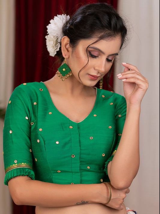 Emrald green cotton silk blouse with overall mirror embroidery highlighted with banarasi lace