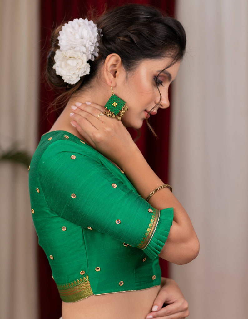 Emrald green cotton silk blouse with overall mirror embroidery highlighted with banarasi lace