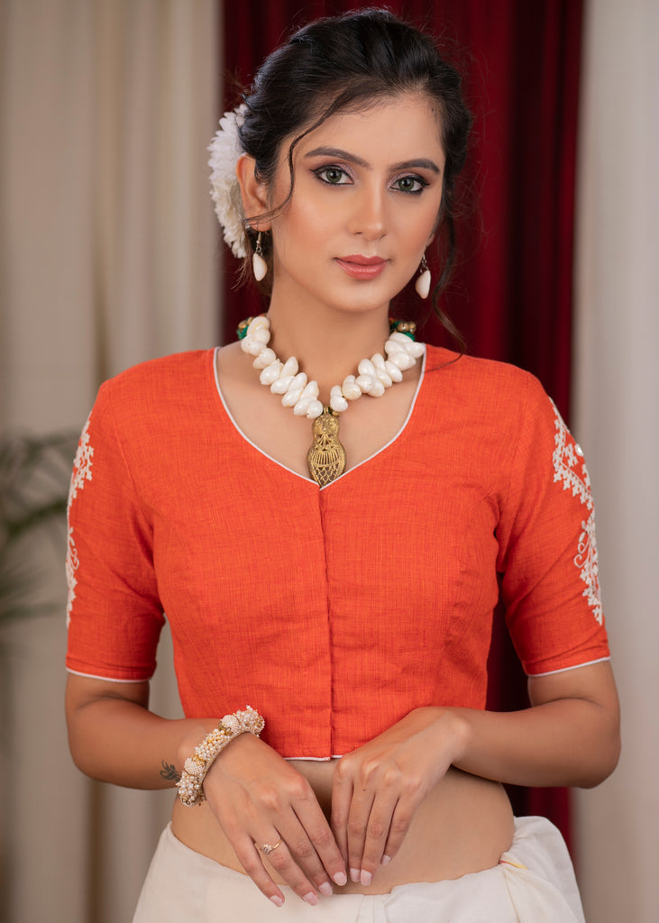 Exclusive orange cotton blouse with beautiful motif embroidery on back and sleeves