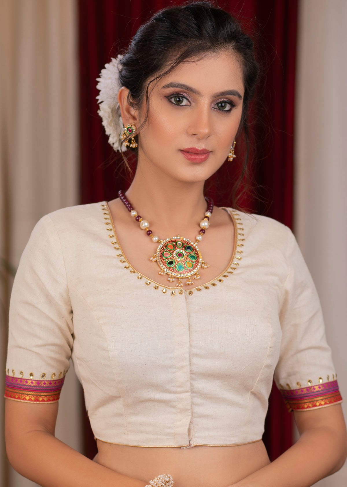 Elegant ivory cotton blouse with overall hand embroidered madhubani motif