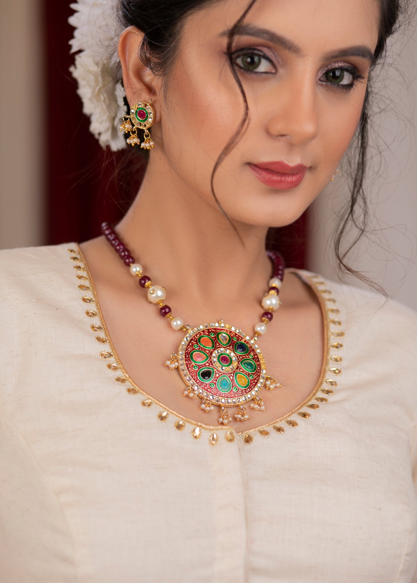 Elegant ivory cotton blouse with overall hand embroidered madhubani motif