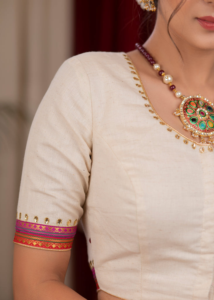 Elegant ivory cotton blouse with overall hand embroidered madhubani motif