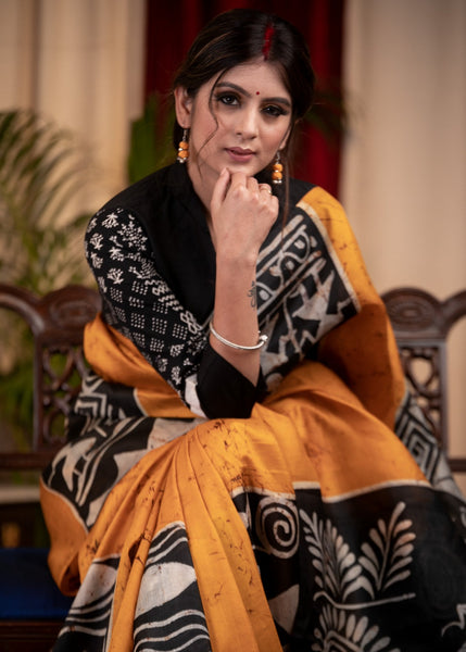 Exclusive pure silk hand batik mustard yellow saree with warli design motifs