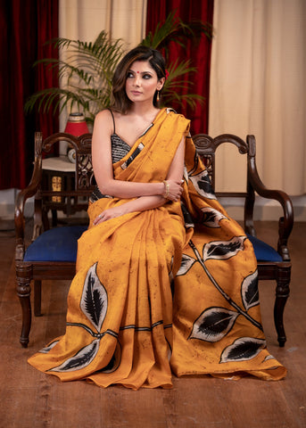 Exclusive hand batik pure silk mustard saree with abstract leaf motifs