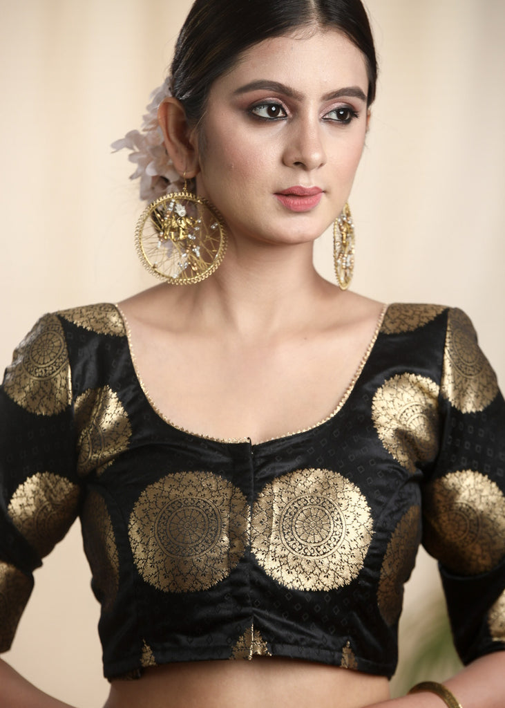 Pure Banarasi Blouse in Black and Gold with Lace on neckline and sleeves . Lining Given