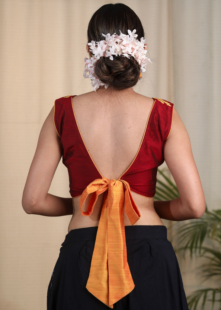 Maroon Cotton Silk Designer Blouse With  Scalop Neck line , Contrast Embroidery and Bow At the Back