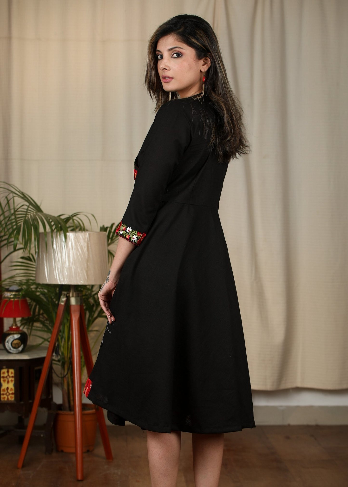 Exclusive black cotton dress with embroidered motifs