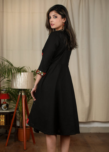 Exclusive black cotton dress with embroidered motifs