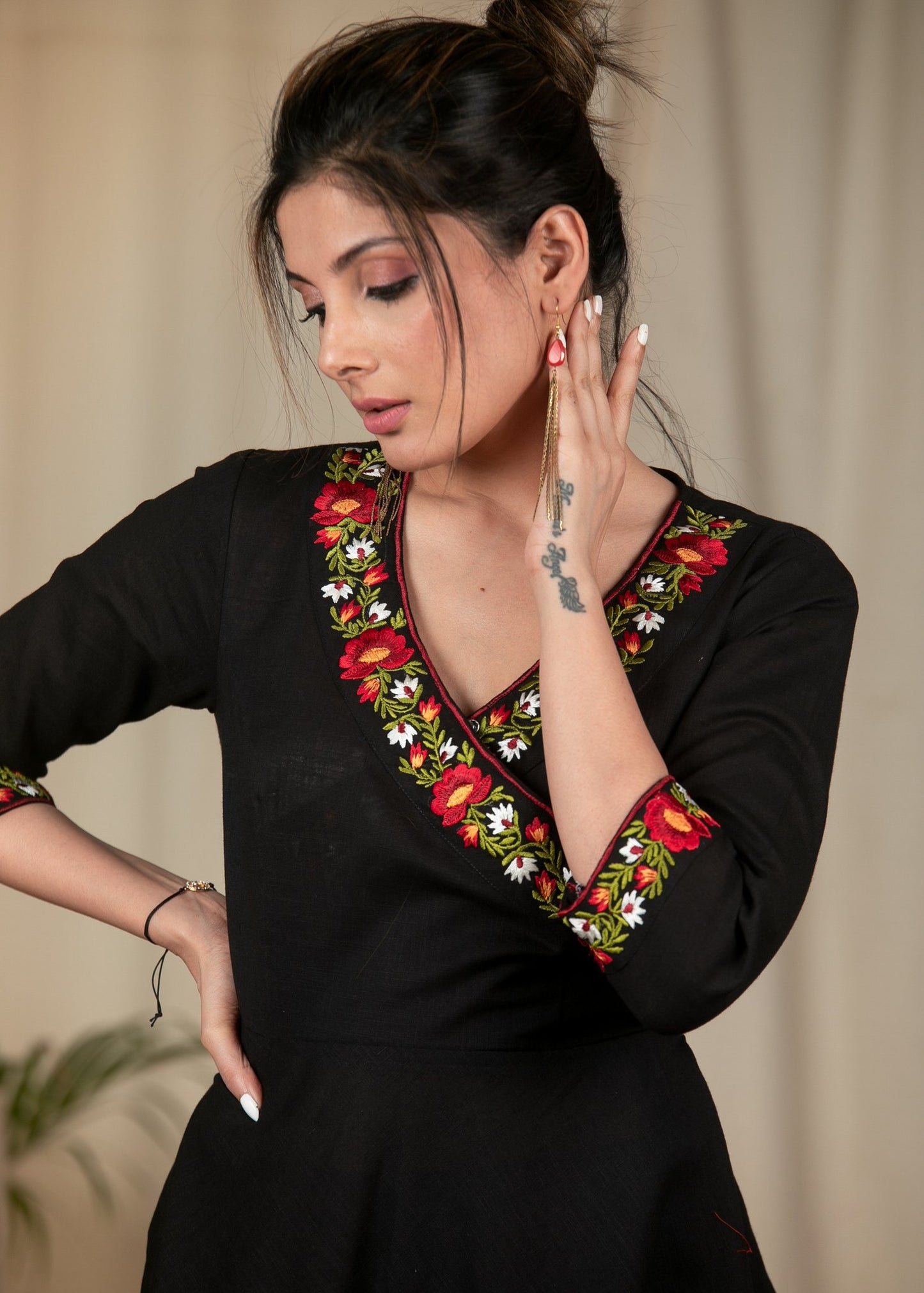 Exclusive black cotton dress with embroidered motifs