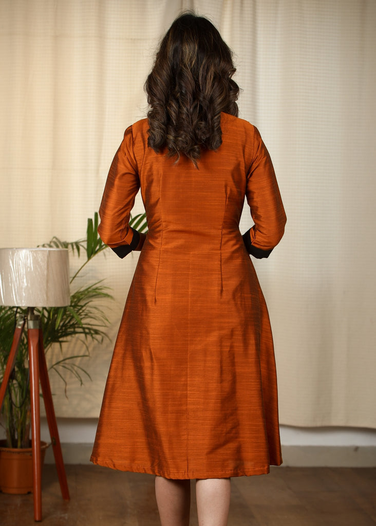 Exclusive Rust cotton silk dress with intricate hand embroidered motif