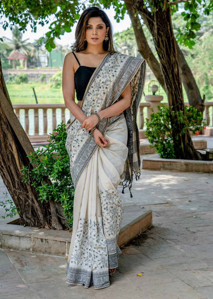 Classic semi sillk heavy embroidered off white saree