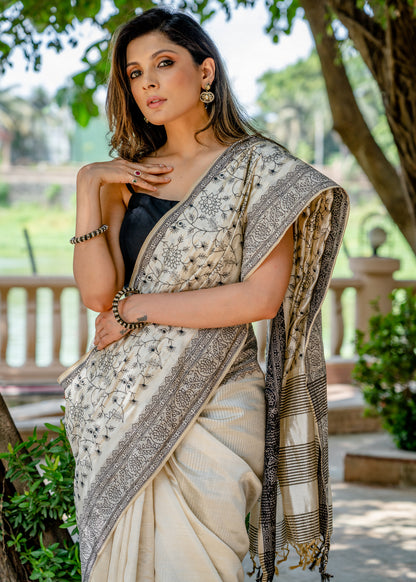 Classic semi sillk heavy embroidered off white saree
