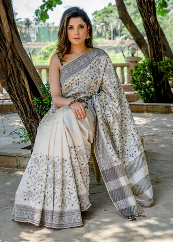 Classic semi sillk heavy embroidered off white saree