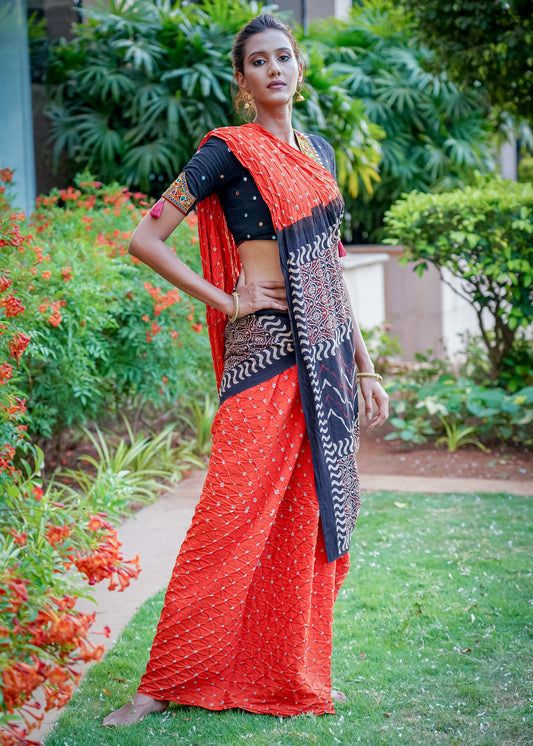 Beautiful orange cotton saree with exclusive Ajrakh & Bandhej combination