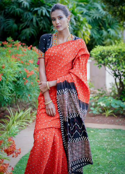 Beautiful orange cotton saree with exclusive Ajrakh & Bandhej combination
