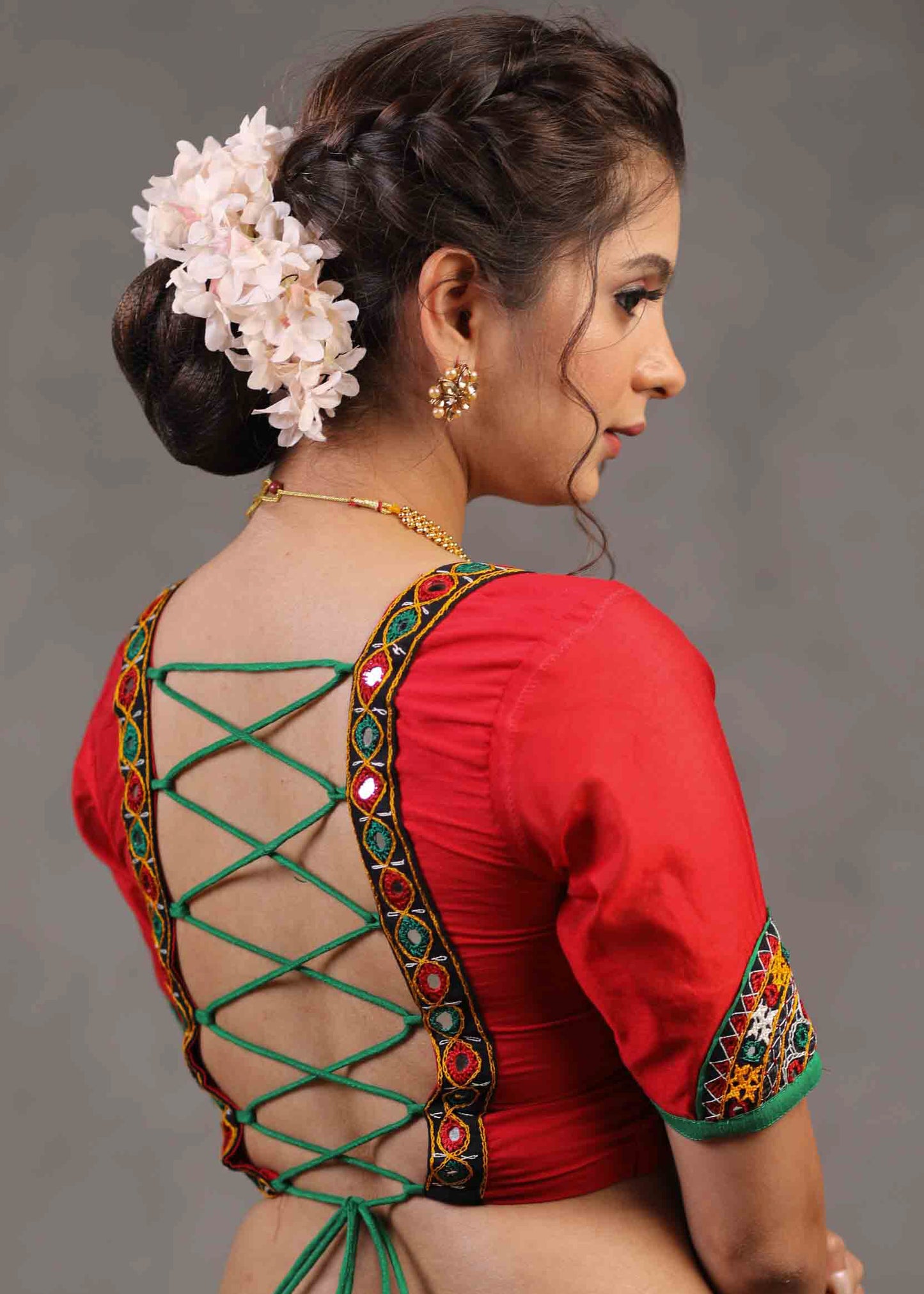 Elegant Red Cotton Silk Blouse Highlighted with Kutch Mirror Work Patch on Sleeves and Neckline