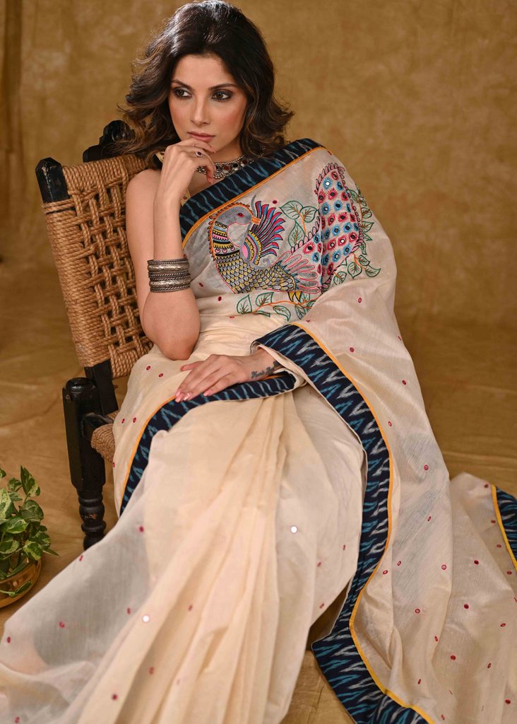 Cream Chanderi Saree with Delicate Peacock Motif Embroidery and Blue Ikaat Border