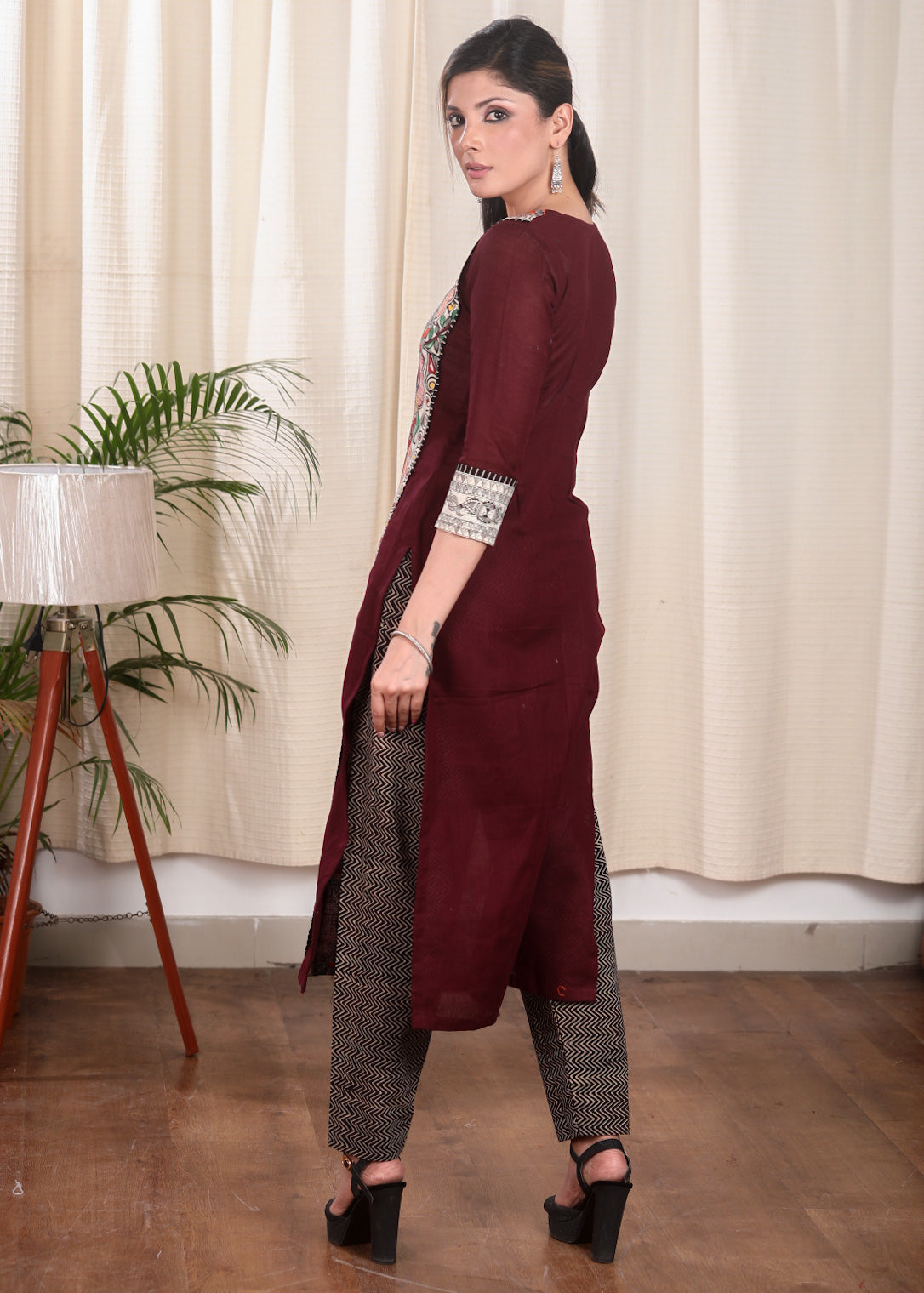 Striking Straight Cut Wine Colour Kurta With Hand Painted Madhubani Panel