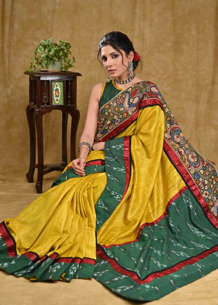 Stunning yellow Ghicha silk saree with Madhubani pallu and green Ikaat border