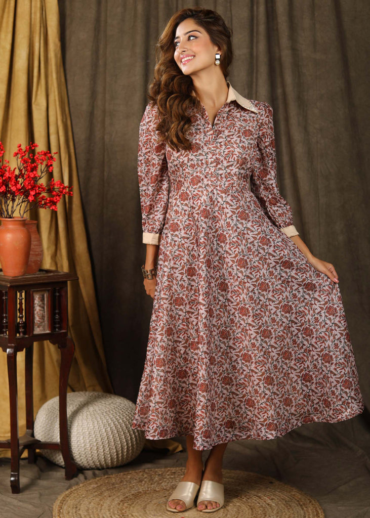 Trendy Kota silk collared dress with beautiful kalamkari print highlighted with pearl embellishments