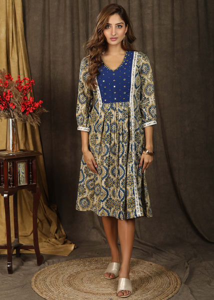 Trendy ajrakh A-line dress with beautiful hand embroidered yoke highlighted with beautiful mirror lace