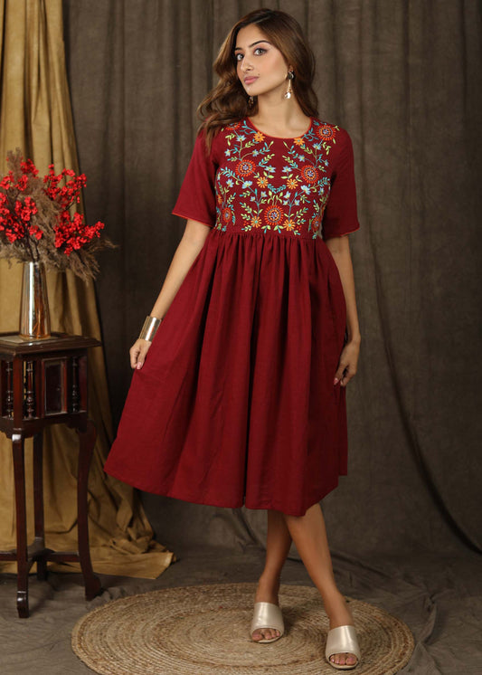Classic maroon gathered dress with minimal floral embroidery and elbow sleeves