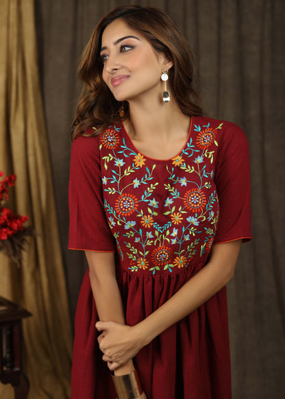 Classic maroon gathered dress with minimal floral embroidery and elbow sleeves