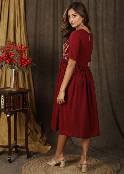 Classic maroon gathered dress with minimal floral embroidery and elbow sleeves