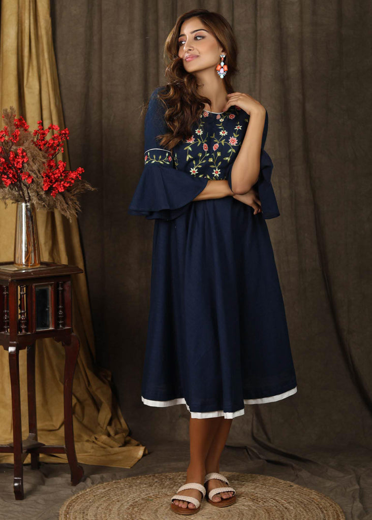 Classic navy blue gathered dress with bell sleeves and minimal floral embroidery