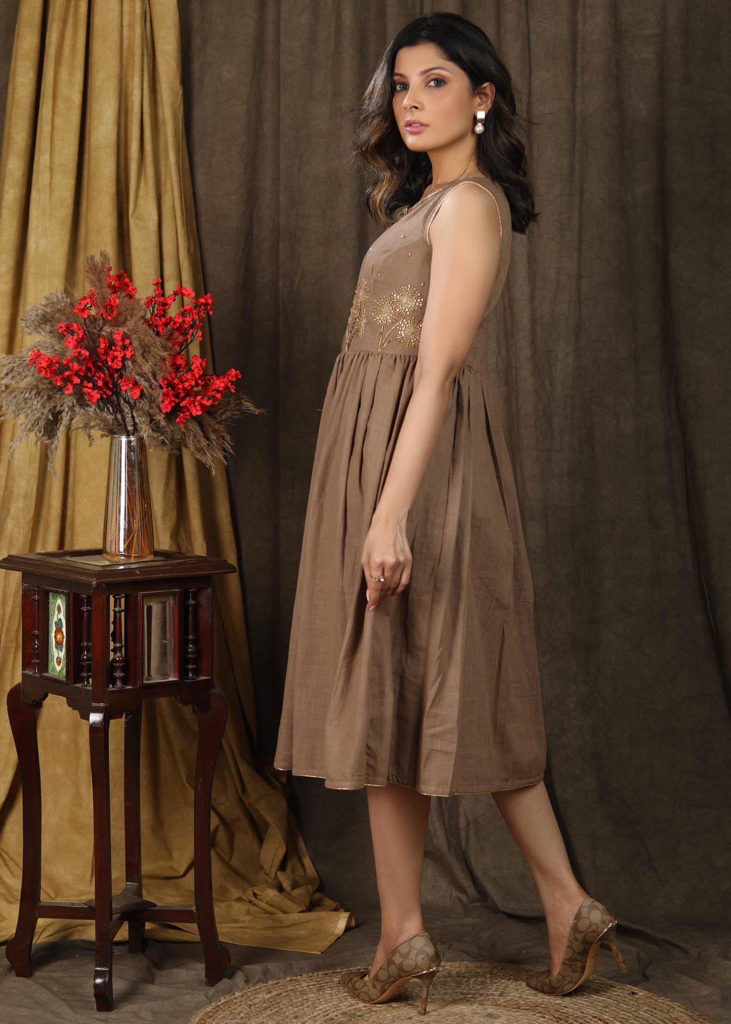 Subtle beige sleeveless gathered dress with beautiful hand embroidery
