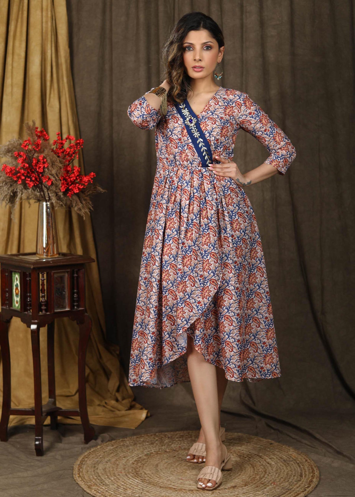 Dussehra Sale — Beautiful floral paisley muslin overalap dress highlighted with classy stonework belt on the neckline