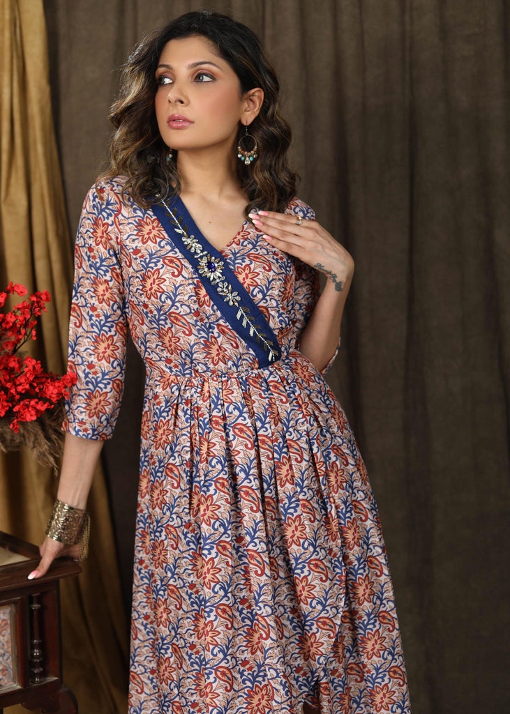 Beautiful floral paisley muslin overalap dress highlighted with classy stonework belt on the neckline