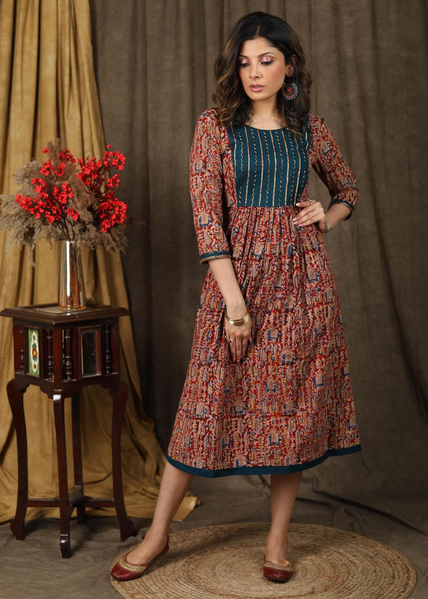 Elegant kalamkari dress with beautiful teal embroidered yoke