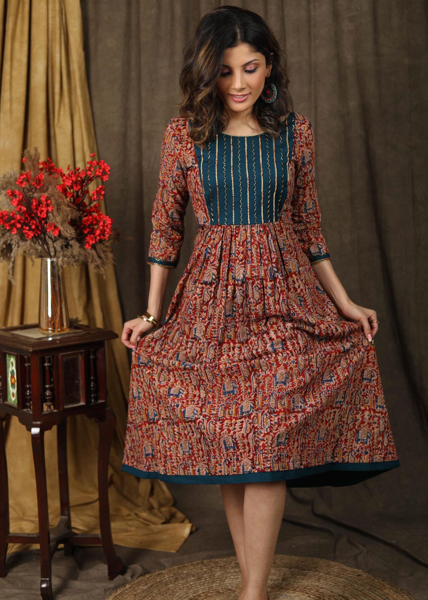 Elegant kalamkari dress with beautiful teal embroidered yoke