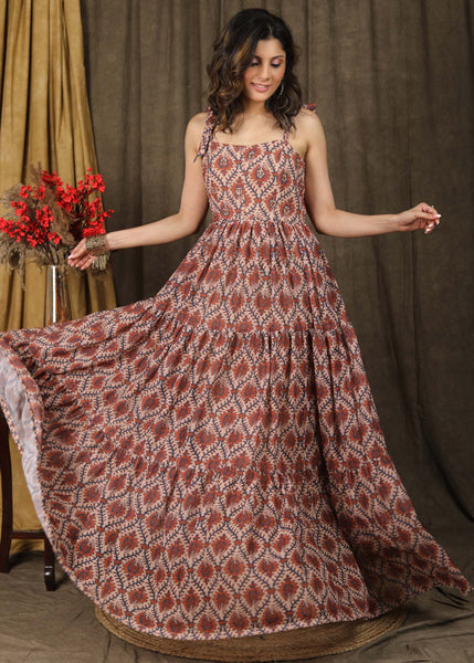 Exclusive boroque print peach maxi dress highlighted with stone embellishments and optional chanderi shrug