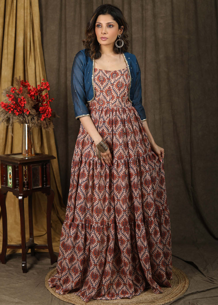 Exclusive boroque print peach maxi dress highlighted with stone embellishments and optional chanderi shrug