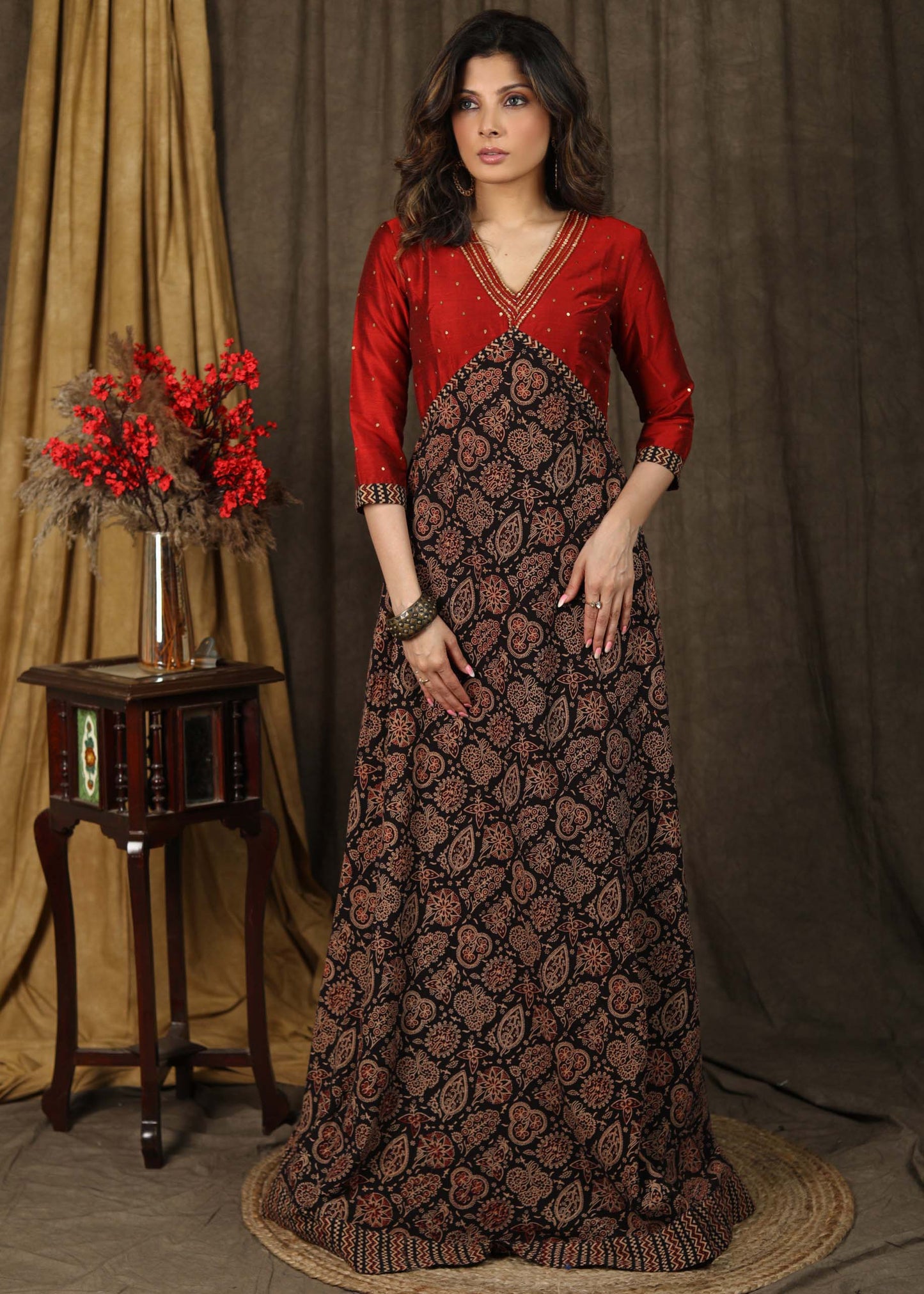 Classy ajrakh combination Kalidaar gown highlighted with hand embroidery on neck and sleeves