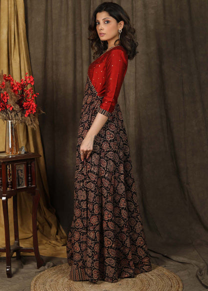 Classy ajrakh combination Kalidaar gown highlighted with hand embroidery on neck and sleeves