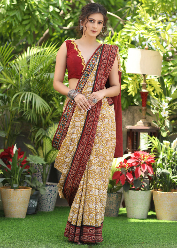 Exclusive mustard printed Cotton saree Accentuated with Ajrakh and Mirror border