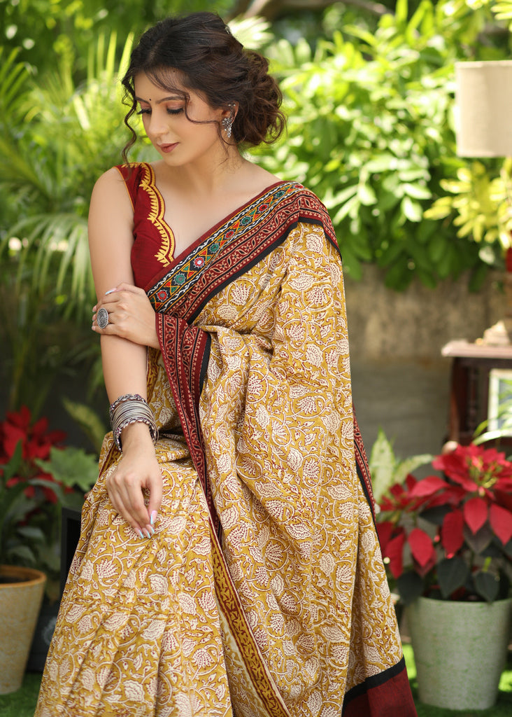 Exclusive Mustard Printed Cotton Saree Accentuated With Ajrakh And Mirror Border