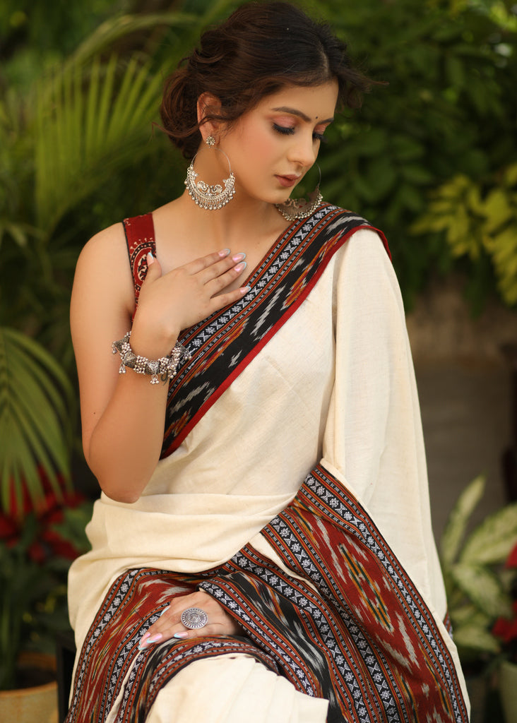 Elegant off-white Cotton saree with beautiful Ikat double border