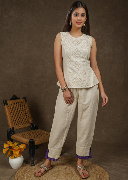 Casual off white cotton ankle length trouser with ikat hemline