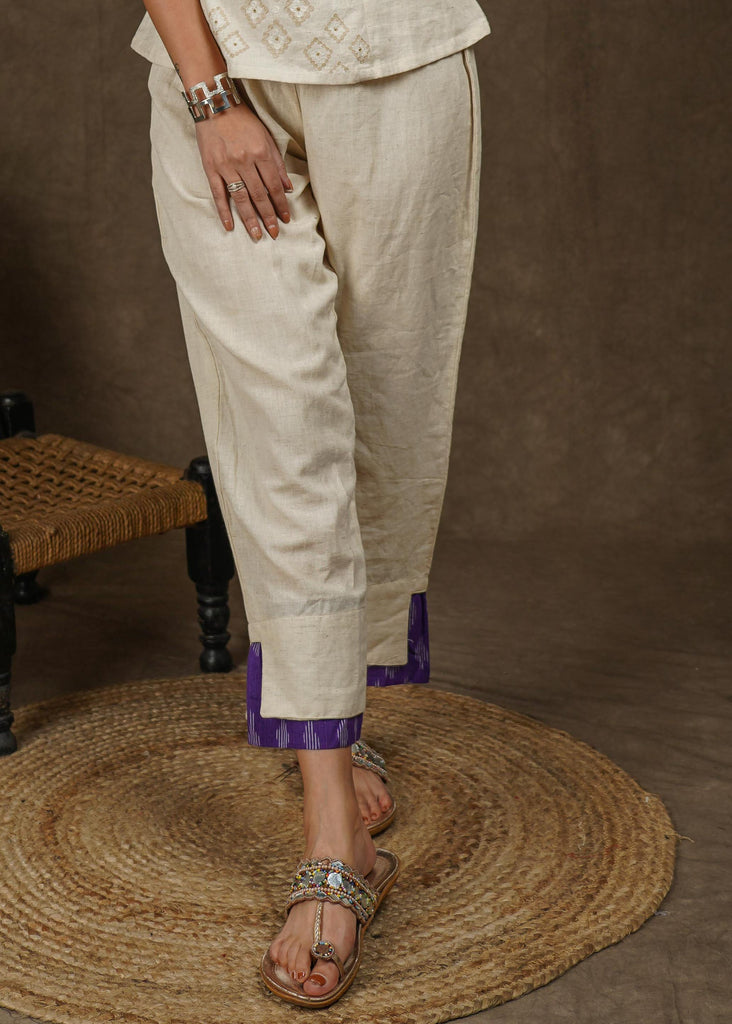 Casual off white cotton ankle length trouser with ikat hemline